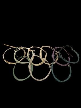 Handwoven  wax-coated string bracelets from Pura Vida set of 9